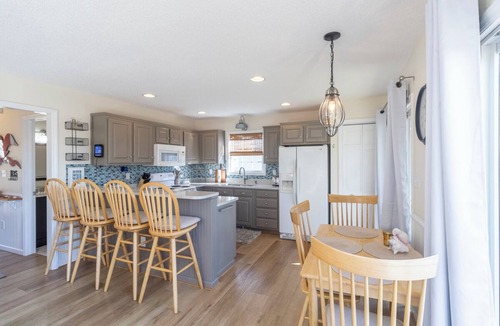 Colington Harbour House | Canalfront home w/wraparound decks and community amenities!
