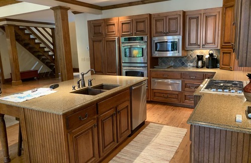 Henderson House | Celebrate Spring! Beautiful, custom Kerr Lake lodge home + private dock.