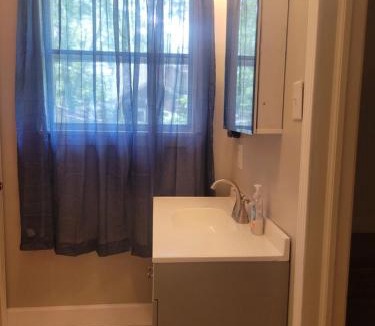 Lumberton Apartment | Central located large home on quiet wooded street