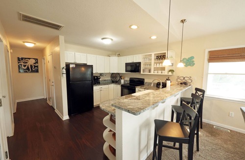 Colington Harbour House | CH113- Beautiful 3 BR on Canal- Stunning Interiors- Sunset Views- Fire Pit!