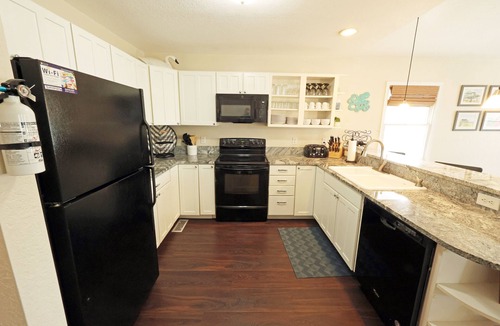 Colington Harbour House | CH113- Beautiful 3 BR on Canal- Stunning Interiors- Sunset Views- Fire Pit!