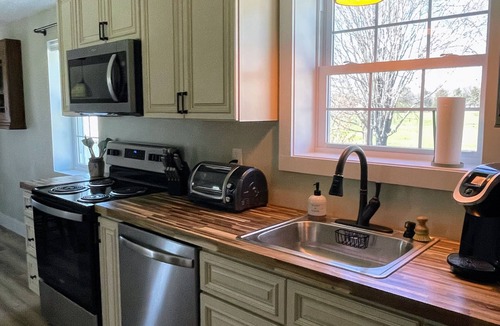 Stokes House | Charming Cottage- Yadkin River, Parks, Wineries and Winston-Salem in East Bend.