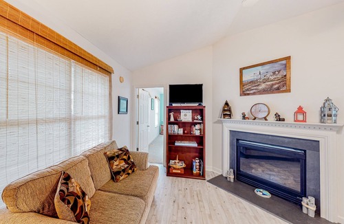Southport House | Charming dog-friendly home with pool access, screened patio, cozy deck & W/D
