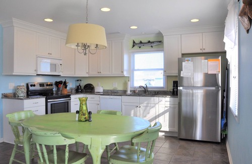 Holden Beach House | Coastal bungalow charm with dock, porch views, and easy beach access in a renovated retreat