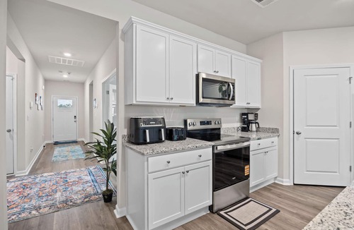 Supply House | Coastal Family Getaway Near Holden Beach with water views, covered patio & games