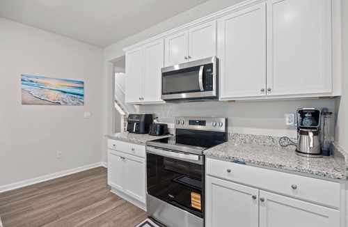 Supply House | Coastal Family Getaway Near Holden Beach with water views, covered patio & games