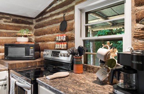 Spruce Pine Cabin | Cozy Hand Built Log Cabin Rocking Chair Porch King Bed