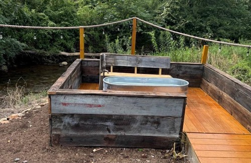 Hillsville RV Rental | Creekfront Safari Tent with Outdoor Bath and Deck in Virginia