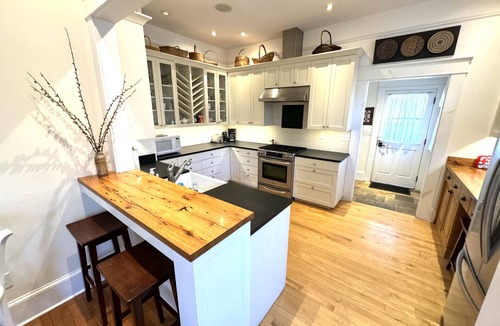 Brevard House | Deluxe Downtown Bungalow - fenced in yard, pet friendly.