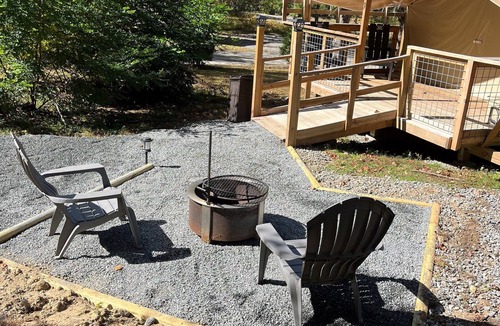 Saluda RV Rental | Deluxe Green River Glamping Tent in nature with wood burning oven!