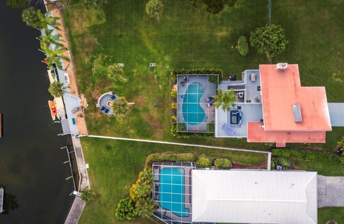 Spring Hill House | Direct Gulf Access | Heated Pool | 45’ Dock + Fire Pit