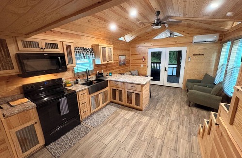 Waynesville Cabin | Escape to the beauty of the mountains in this cozy 2-bedroom tiny home.