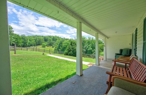 Galax House | Escape to this spacious countryside retreat featuring beautiful mountain views, a wraparound porch.