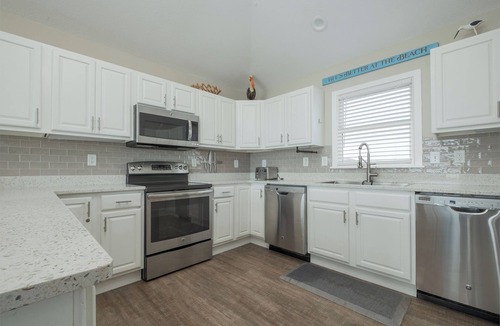 Ocean Sands House | Experience luxury at 1861 - Into the Mystic, a spacious 6-bedroom oceanfront home in Corolla, NC.