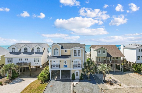 Holden Beach House | Experience oceanfront bliss at Inn Between, a spacious 6-bedroom getaway in Holden Beach.