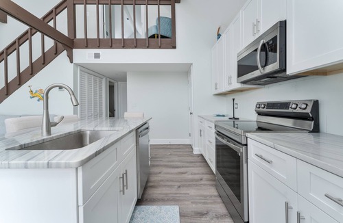 Colington Harbour House | Experience the serene beauty of the Soundfront at Shenanigan's, a charming home in Kill Devil Hills