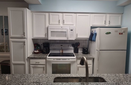 Sunset Beach Condo | Extra large first floor condo with indoor & outdoor pools, close to the beach.