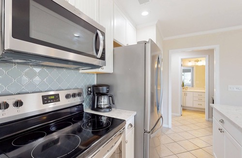 Sea Trail Condo | First-floor condo with golf, pool, gym, & tennis - direct beach access & patio