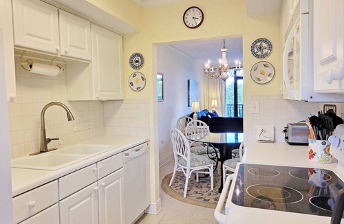 North Litchfield Beach Condo | Fourth Floor Condo across from Beach Access, Balcony, Pool, Grill Area, Elevator