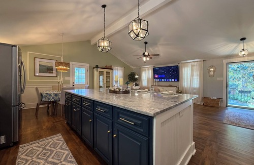 Raleigh House | French Country Retreat in North Hills, Fenced Yard, Game Room