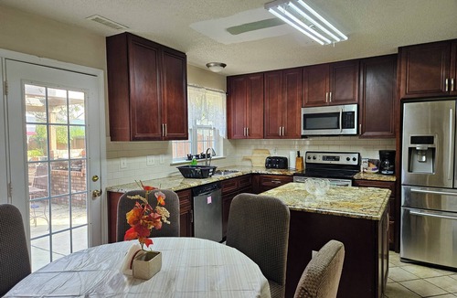 Apex House | Garden Retreat close to Jordan Lake-Screened porch-fenced backyard-large deck
