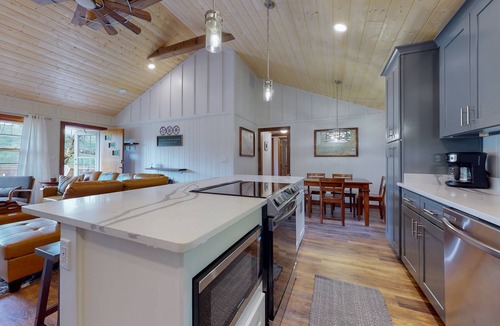 Penrose House | Inviting home with game room, firepit, full kitchen, central AC, & W/D