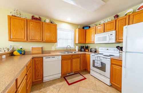 Colington Harbour House | K1552 BeachBumz- Canalfront! Community Pool! Private Dock!