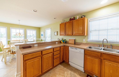 Colington Harbour House | K1552 BeachBumz- Canalfront! Community Pool! Private Dock!