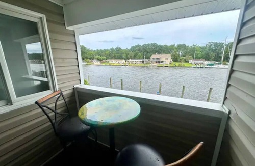 Coinjock Apartment | Knot Two- Balcony View of ICW- Dog Friendly