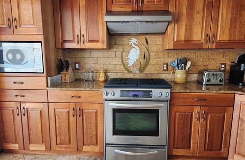 Ocracoke House | La Fortezza: Soundfront, large yard, covered porches, small dock.