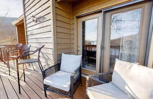Lake Lure Condo | Lakefront condo with wood-burning fireplace, WiFi, two decks, & great views