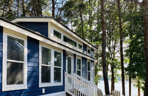Steele Creek Cabin | Lakefront Two Bedroom Tiny Home #15 on the lake at Long Cove Resort by RedAwning