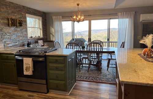 Frank House | Long range views. Sleeps 10! Hot tub, game tables and close to everything!