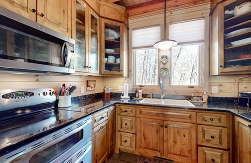 Highlands House | Luxe home overlooking Blue Valley & a stream with elevator & designer interior