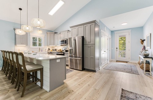 Tranquil Harbour House | Luxurious 4-Bedroom Dog-Friendly Retreat in Oak Island w/6 Seater Golf Cart & 7 Person hot tub