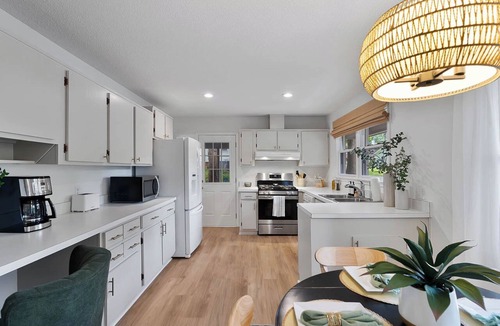 North Hills House | Luxurious 4BD near Downtown and RDU, with sunroom, theatre, games, & more!