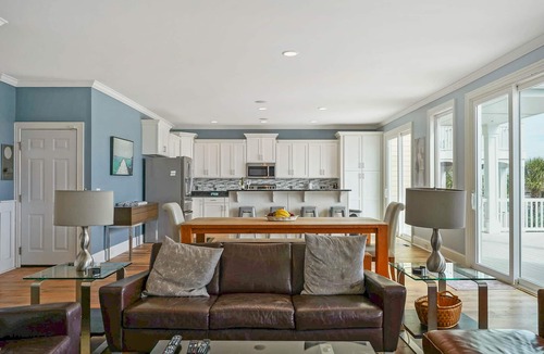 Sunset Beach House | Luxurious Sunset Beach Home On The Water With Pool, Boat Dock and Golf Cart