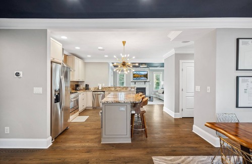 Commonwealth Park House | Luxury Charlotte Home with Stunning Pool & Hot Tub & Waterfalls