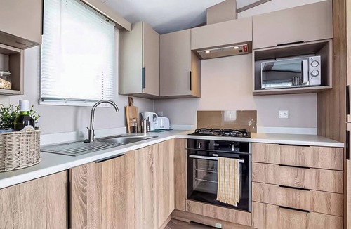 Selsey House | Modern, stylish and spacious 12ft-wide caravan with one double and two twin.