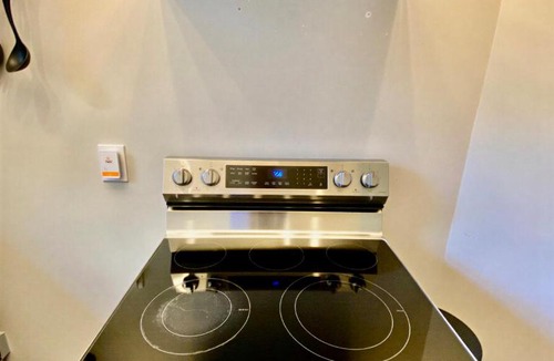 Wilmington Apartment | Modern Top-Floor Loft-Pool, Balcony & Garden View!