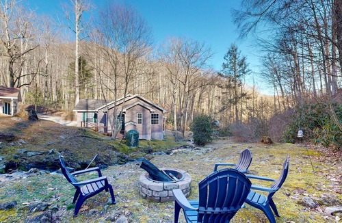 Sylva House | Mountain view home with a fireplace with beautiful view of the creek