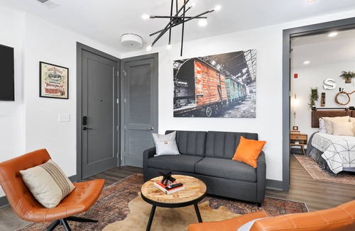 Rolling Mill Hill Condo | Muse | Nashville-themed condo with oversized balcony, downtown views & putting mat
