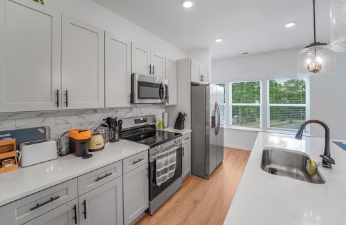 Cotswold House | New Stylish Townhome in Cotswold with Ensuite Baths, Chef's Kitchen & EV Charger