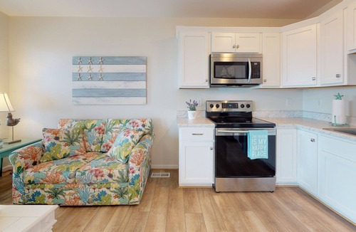 Surf City Condo | Oceanview condo located within walking distance to the beach!