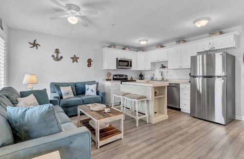 Surf City Condo | Oceanview condo located within walking distance to the beach!
