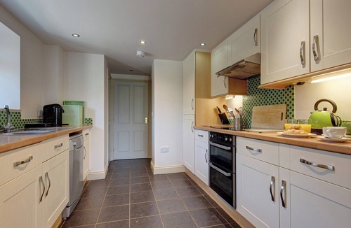 West Beckham Cottage | Open plan living accommodation with bi-fold doors.
