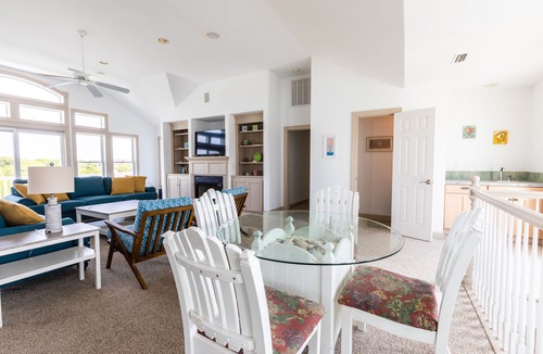 Southern Shores House | Peaceful lakefront views with private saltwater pool, large scale living, and wonderful amenities