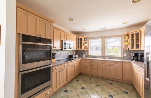 Southern Shores House | Peaceful lakefront views with private saltwater pool, large scale living, and wonderful amenities