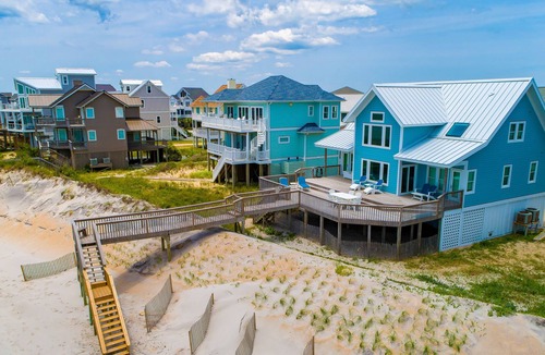 Village of Stump Sound House | Quaint beachfront cottage with Ping-Pong table, decks, community pool & views