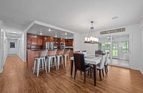 River Bend House | Quiet Riverfront 3BR/2BA house with Spa, Dock, and Golf Carts